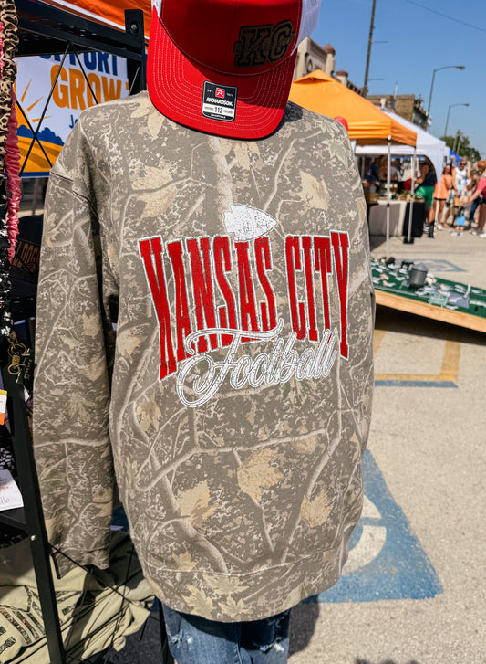 Kansas City football camouflage crewneck sweatshirt with distressed red and white football graphic, trendy KC game day apparel