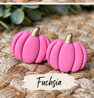 Colorful pumpkin stud earrings in orange, pink, green, blue, white, black, leopard print, and other fall colors displayed together.