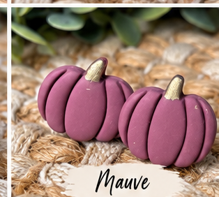 Colorful pumpkin stud earrings in orange, pink, green, blue, white, black, leopard print, and other fall colors displayed together.