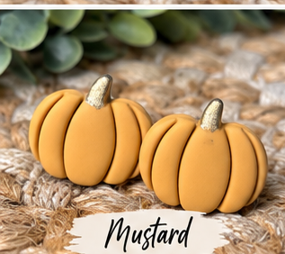 Colorful pumpkin stud earrings in orange, pink, green, blue, white, black, leopard print, and other fall colors displayed together.